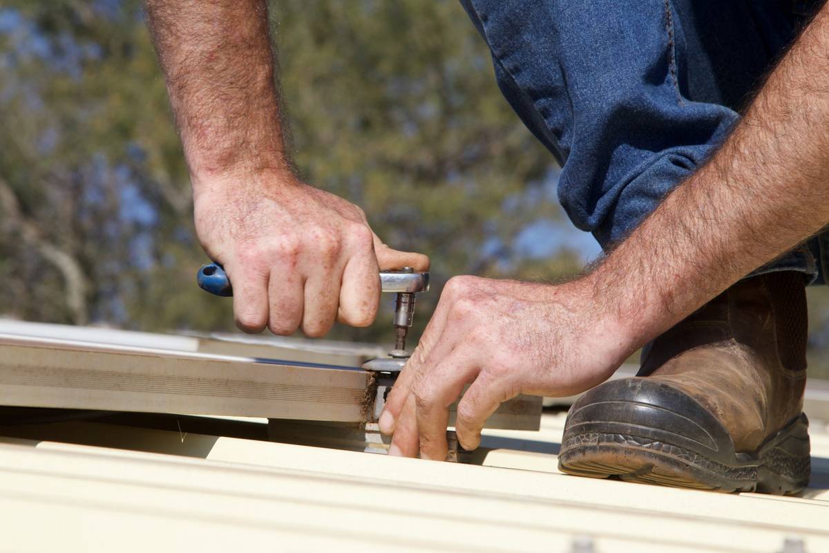 Close-up of hands wearing safety gear diy work glove that protects against cuts and abrasions during home repair