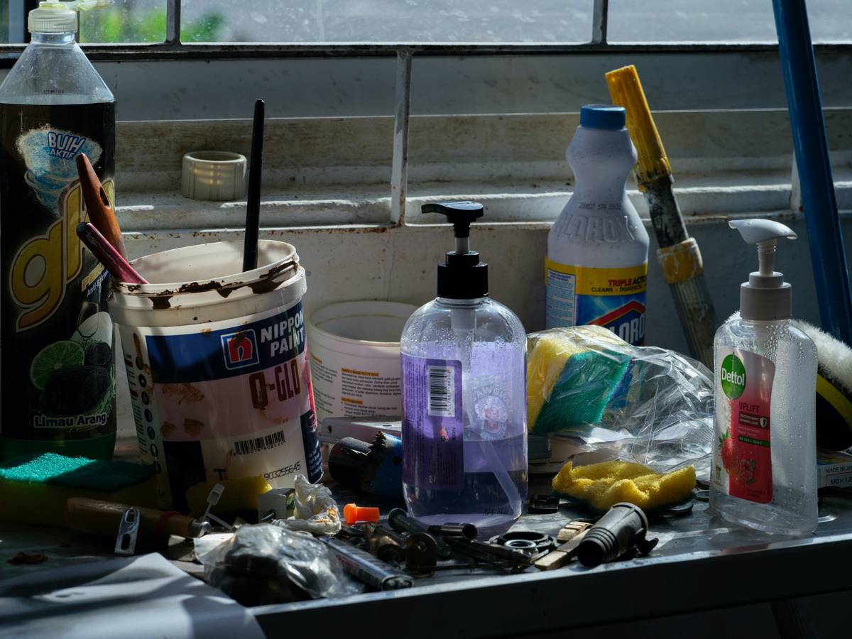 Close-up of cleaned wrenches and pliers arranged neatly on a workbench with diy home maintenance tips cleaning label