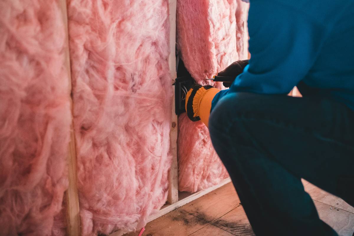diy home maintenance tips proper: close-up of hands replacing a faucet washer with correct tools laid out on a towel