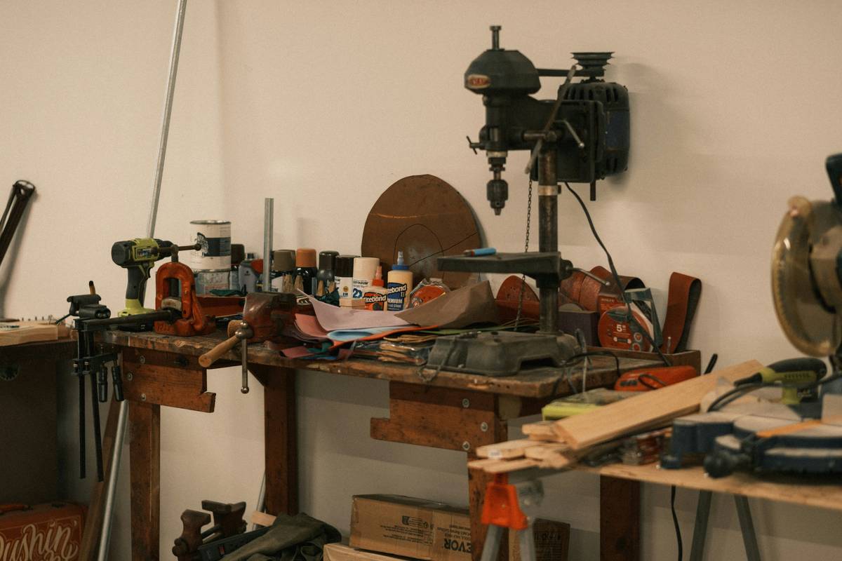 diy home repair tips showing a homeowner using proper tools to fix a leaky faucet